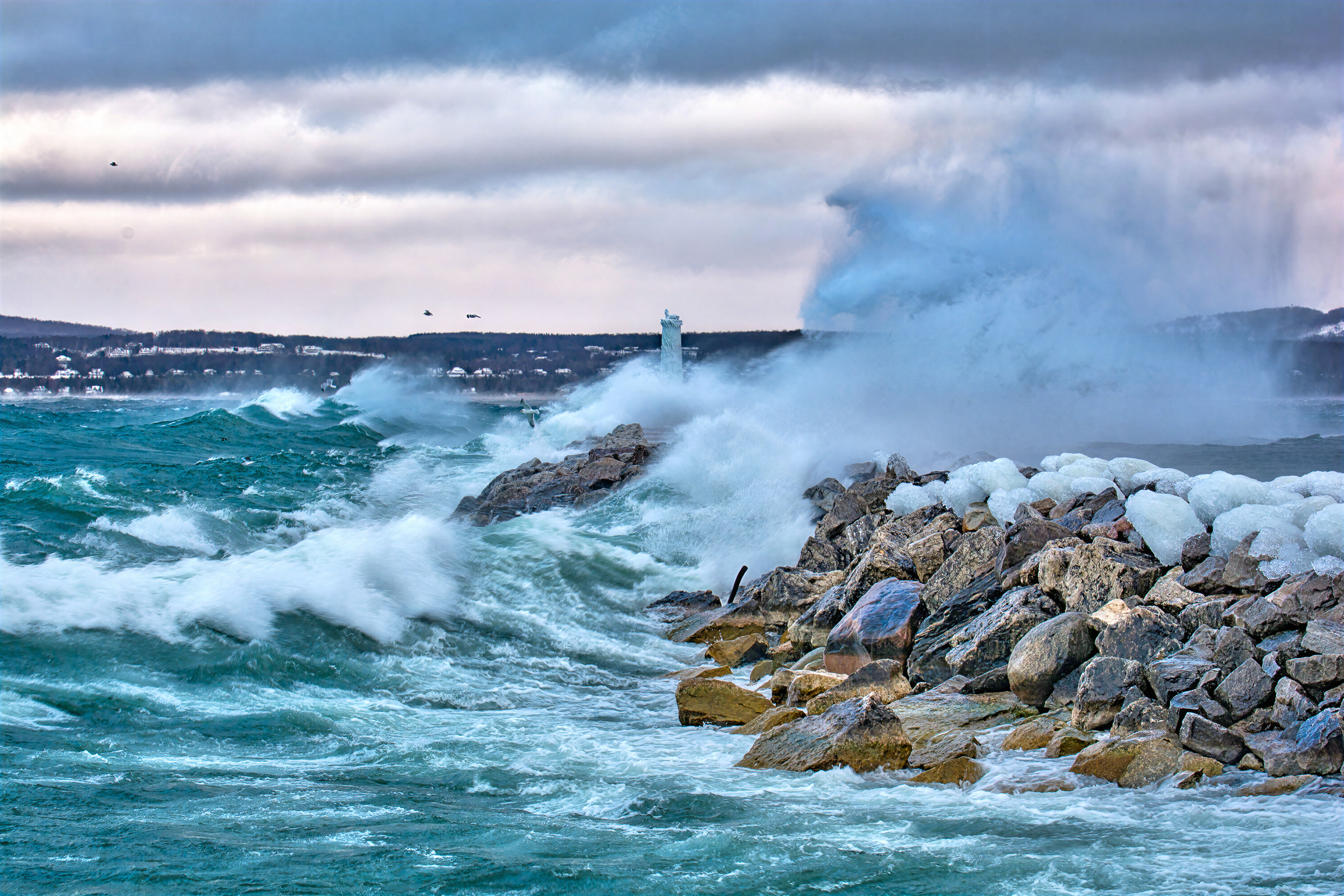 Waves striking the Petoskey breakwall at the beginning of winter